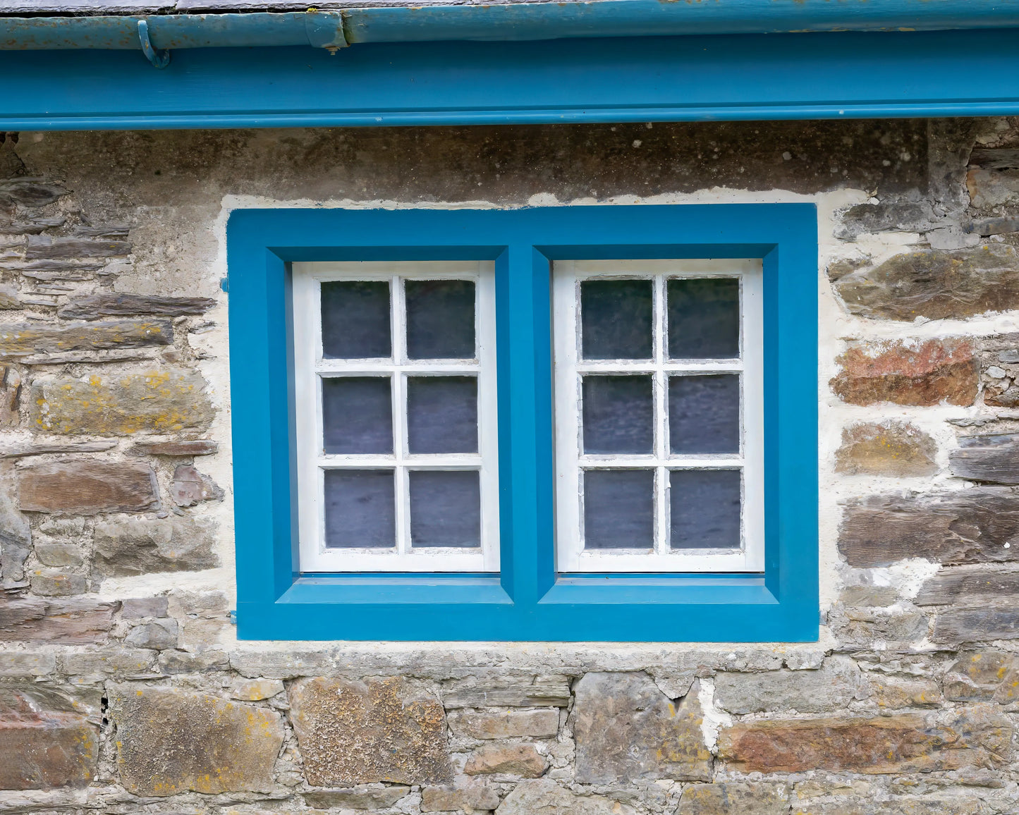 Old Blue Window captured in detailed architecture photography